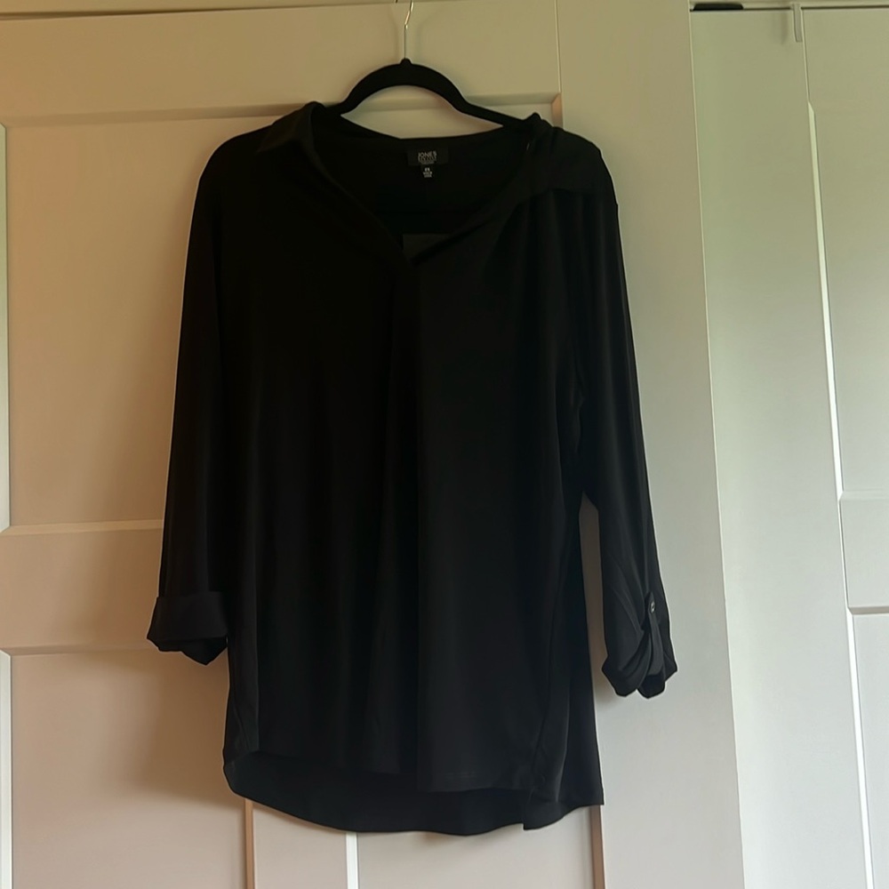 Black Jones New York ton with collar and rolled sleeve details.
